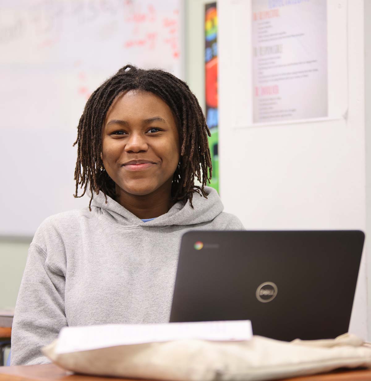 Student drawing in a classroom.