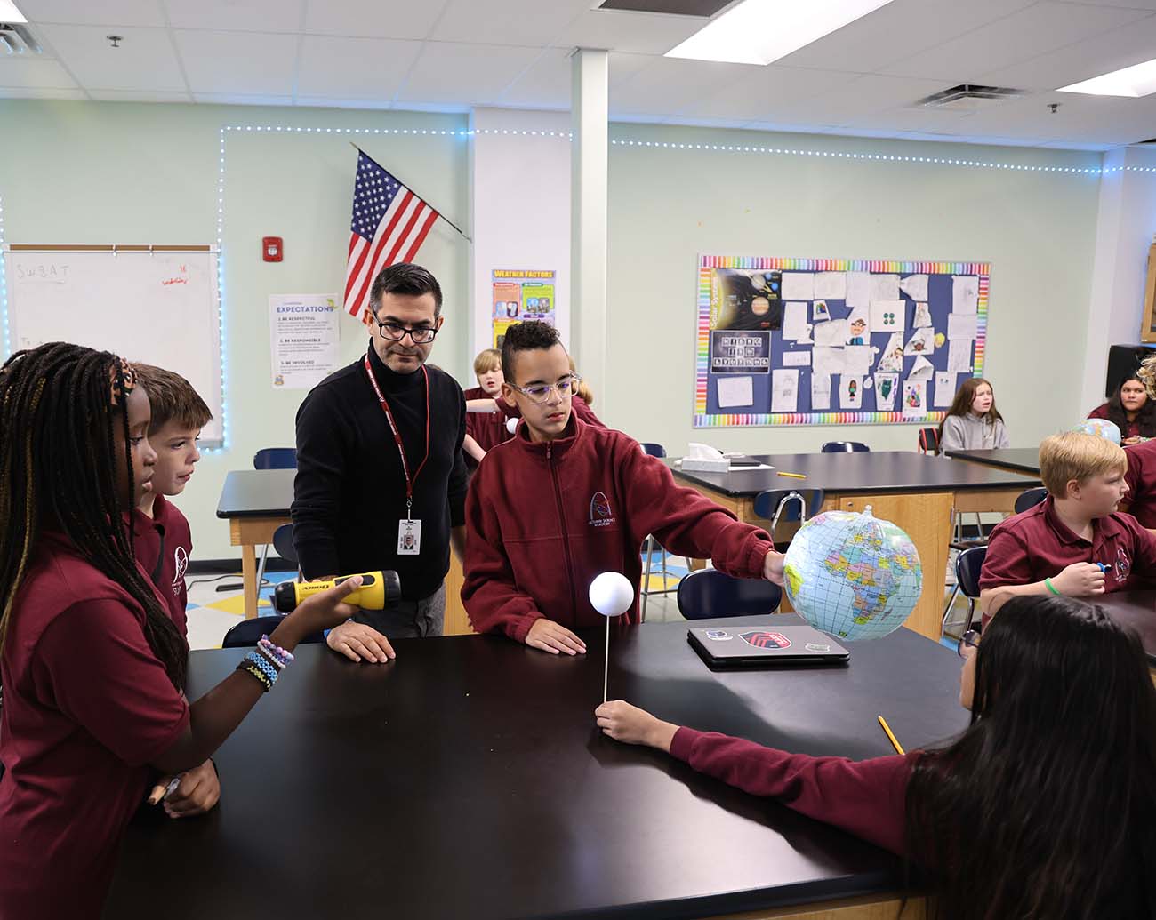 Teacher or school staff member warmly interacting with a student outside