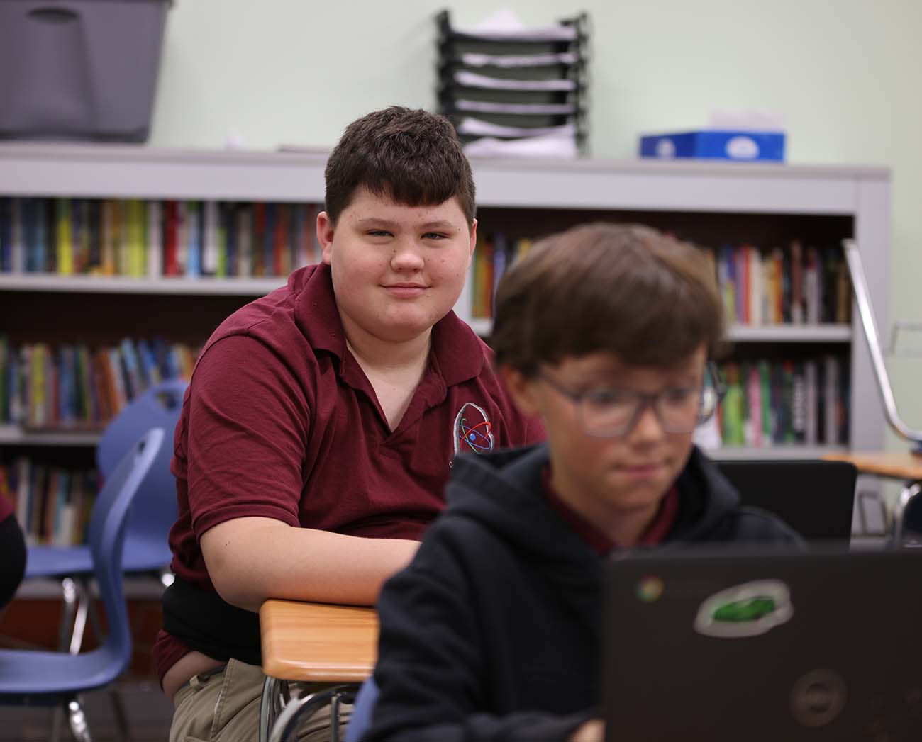 Smiling children together outdoors.